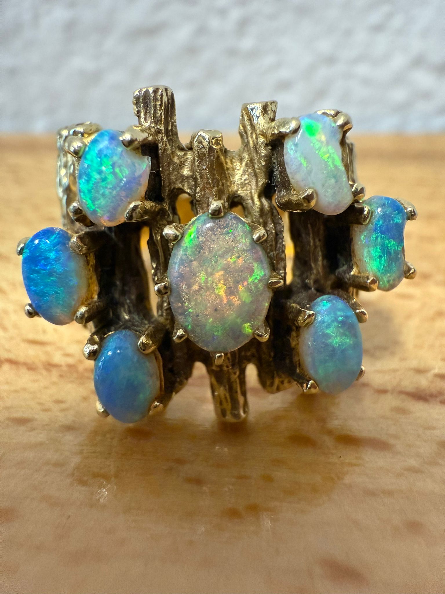 McAllen Jewelers Vintage 14K Yellow Gold opal cluster ring with natural white opals and textured wide band