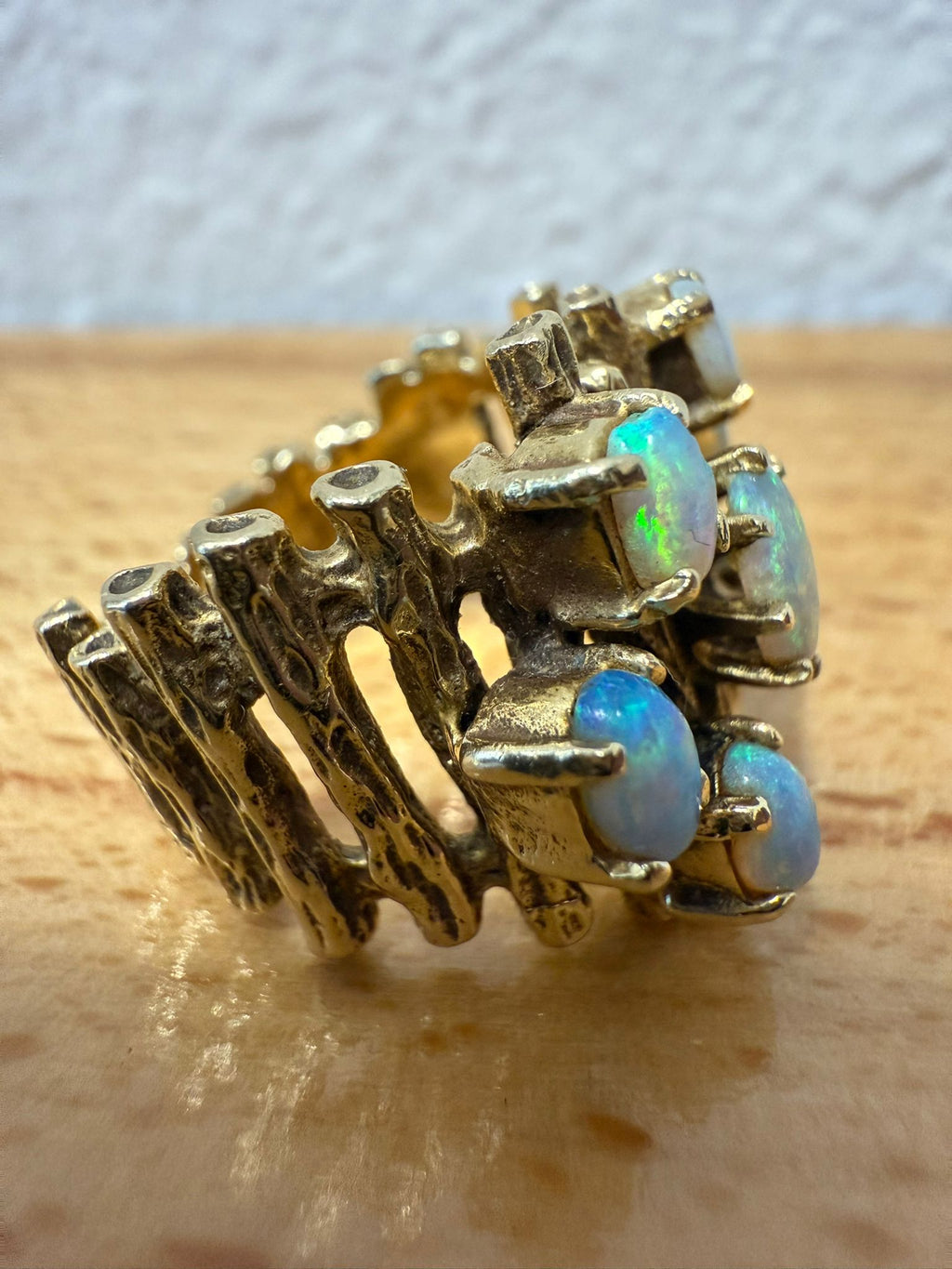 McAllen Jewelers Vintage 14K Yellow Gold opal cluster ring with natural white opals and textured wide band