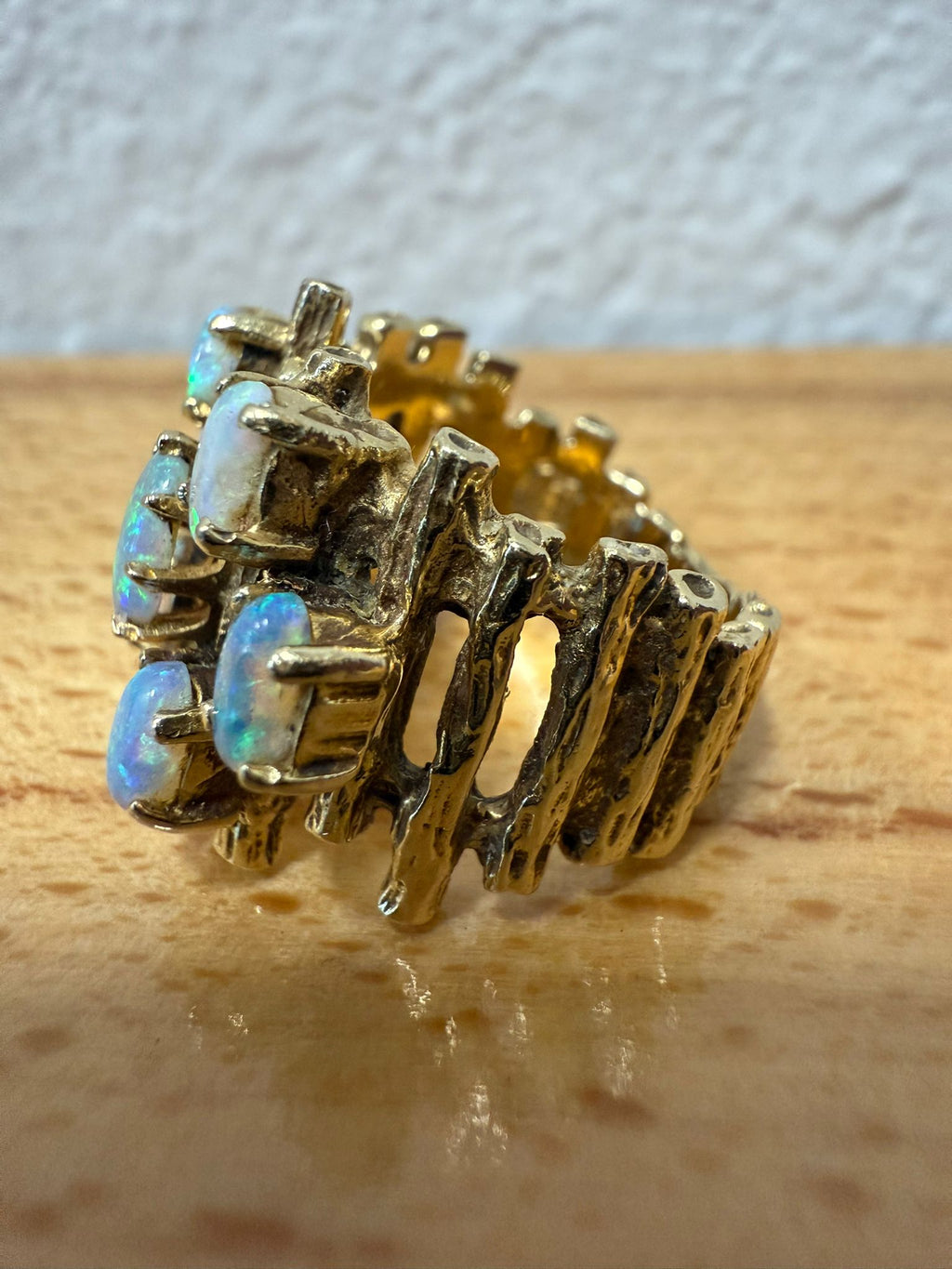 McAllen Jewelers Vintage 14K Yellow Gold opal cluster ring with natural white opals and textured wide band