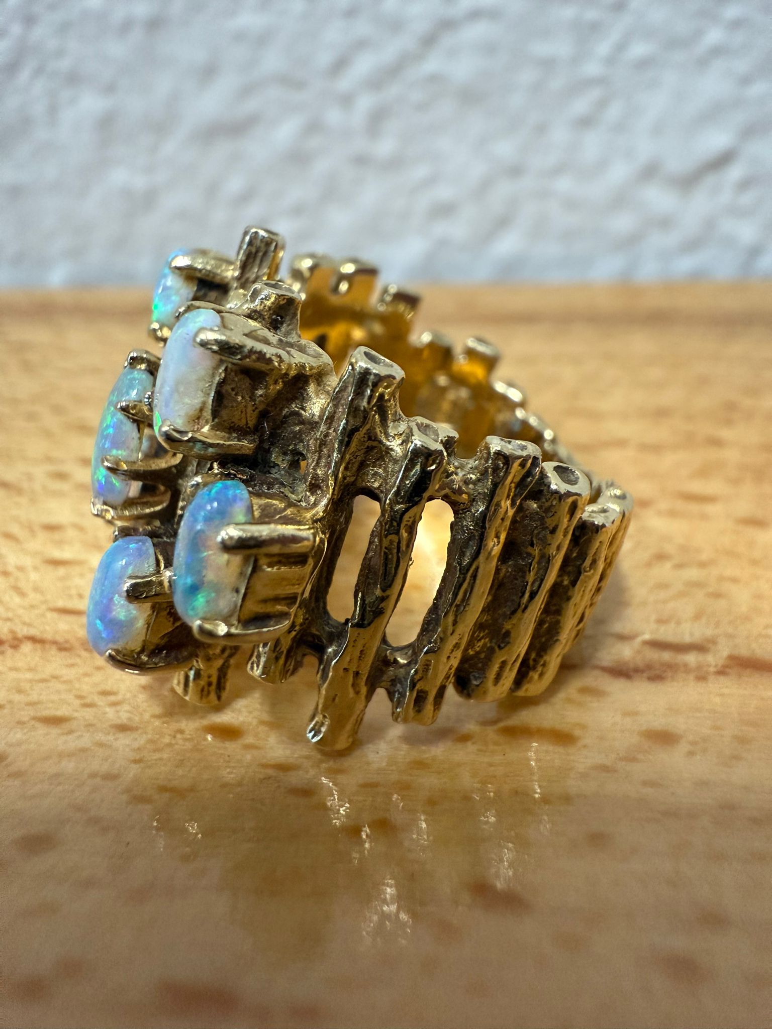 McAllen Jewelers Vintage 14K Yellow Gold opal cluster ring with natural white opals and textured wide band