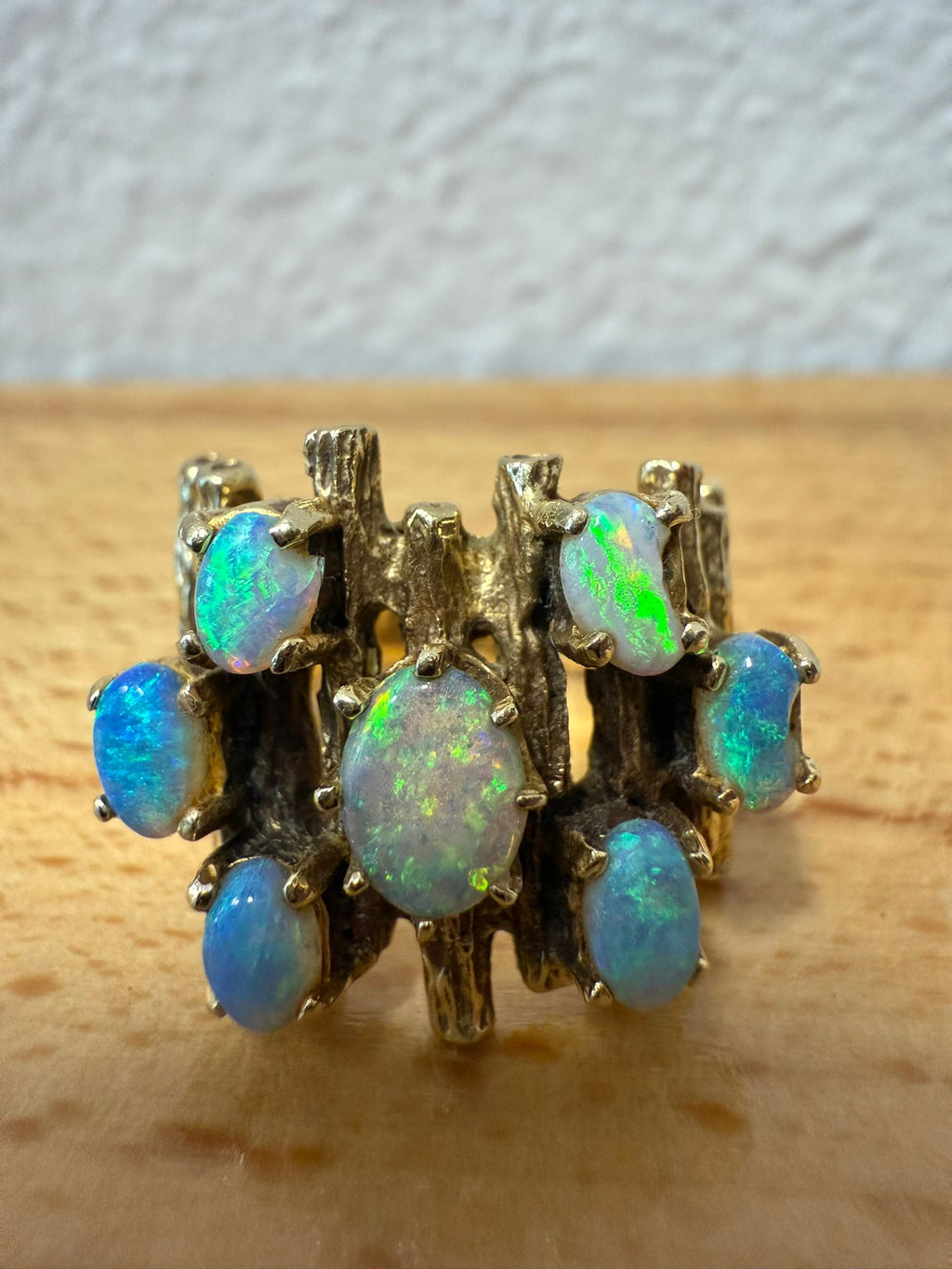 McAllen Jewelers Vintage 14K Yellow Gold opal cluster ring with natural white opals and textured wide band