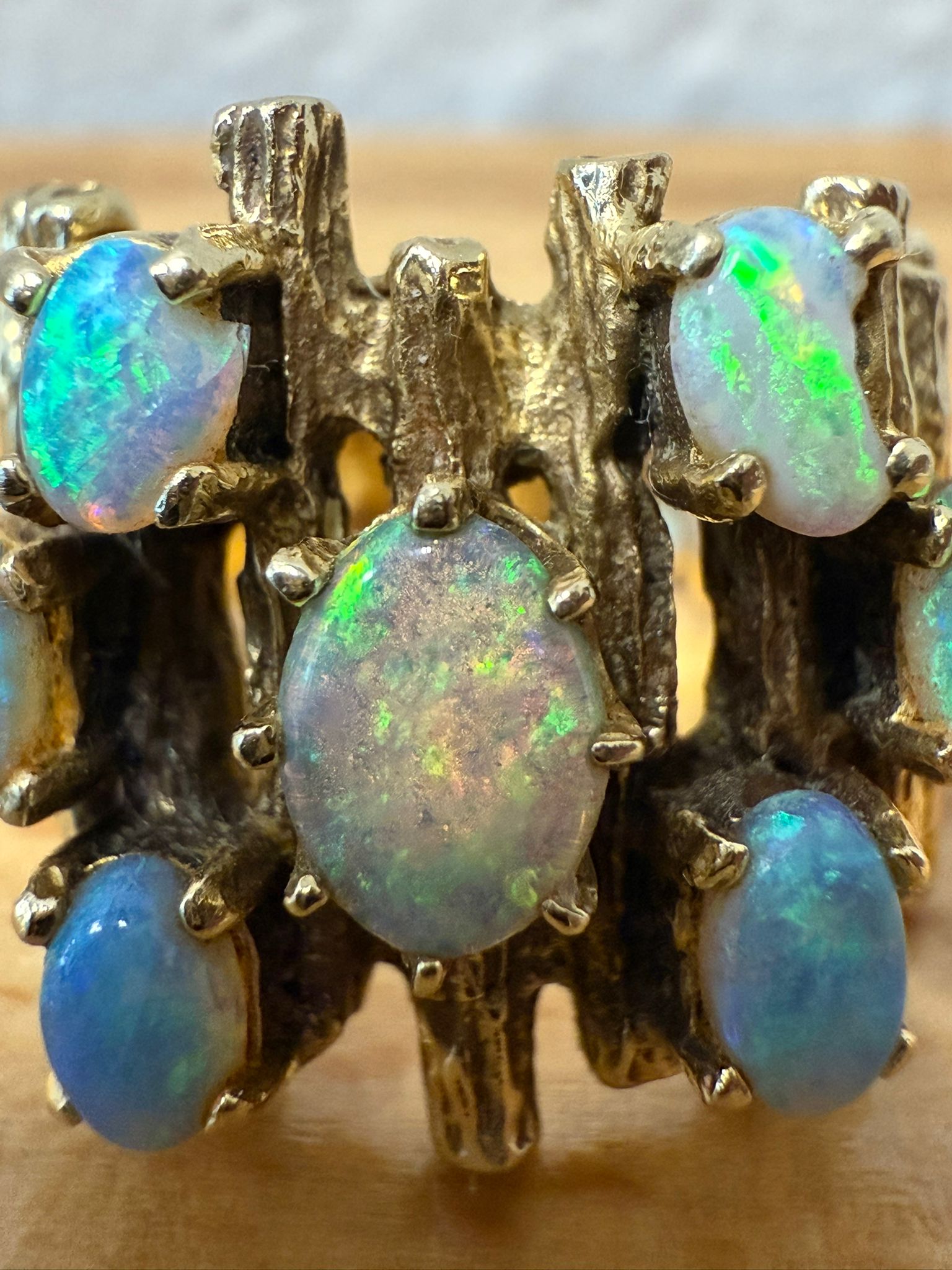 McAllen Jewelers Vintage 14K Yellow Gold opal cluster ring with natural white opals and textured wide band